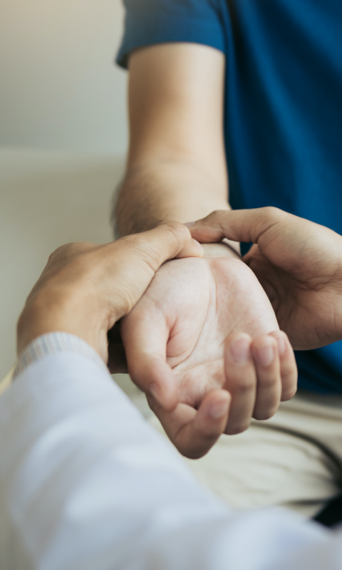 Doctor examining a patients hand for Missouri personal injury attorneys