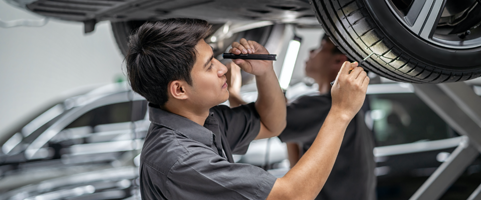 Mechanic inspects a car for product liability lawyers.