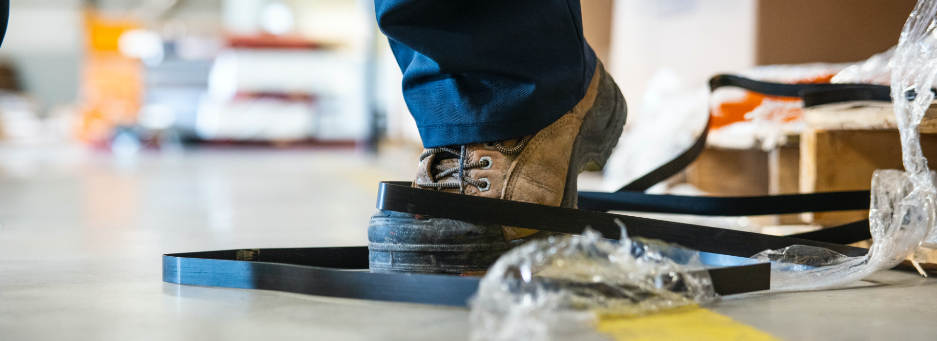 Boot caught in wires, causing person to trip and fall in the workplace and need a slip and fall lawyer