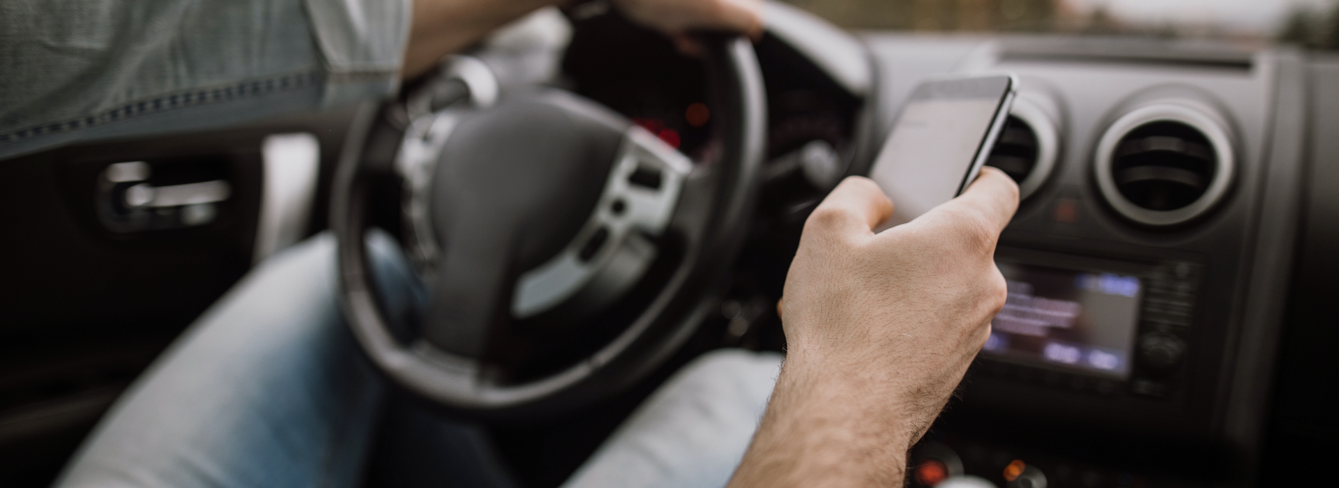 Man driving while texting may cause a car crash.