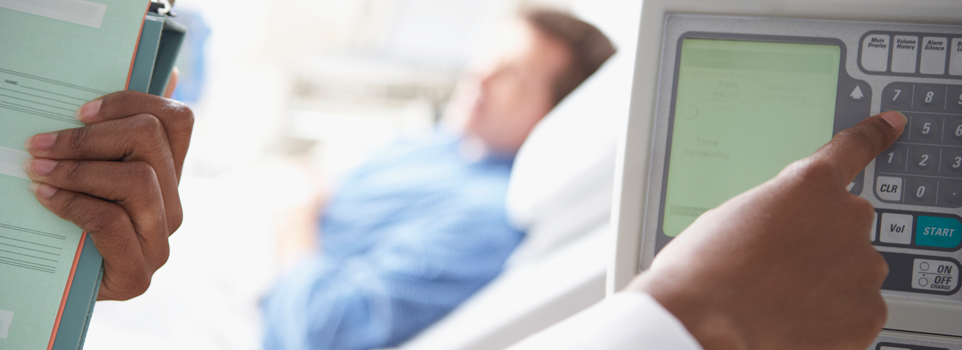 Man lying in hospital bed while doctor makes a hospital error.