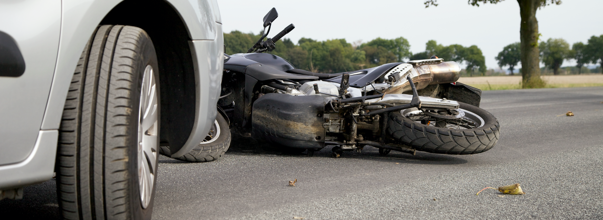 Bike lies on ground after a motorcycle crash.