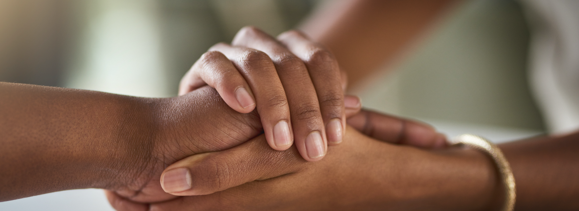 Loved one hold hands to console each other as the cope with the loss of a wrongful death.