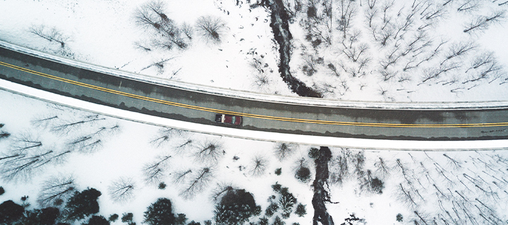 Car driving on windy road in the winter. the winter