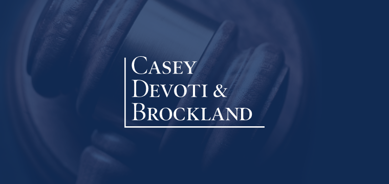 Casey Devoti & Brockland logo over a gavel in personal injury case