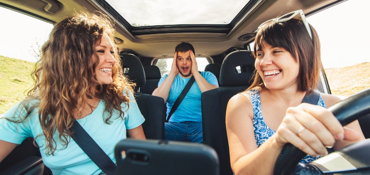 Teenage drivers in the car with friends