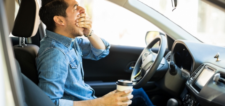 man falling asleep at the wheel